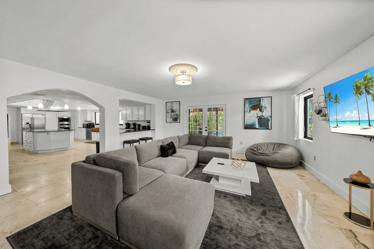 Bright family room connected to a large kitchen